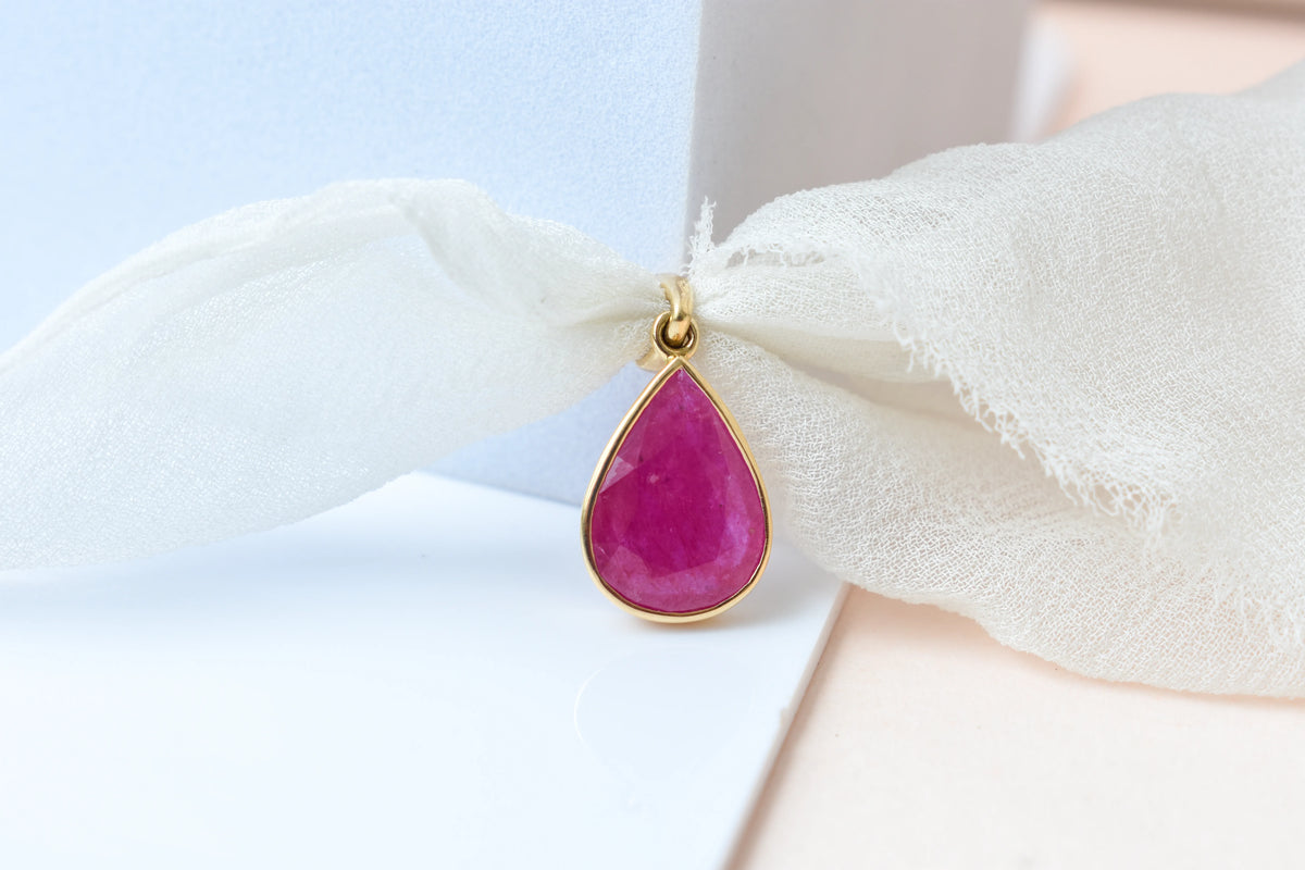 18K gold pendant with bezel-set rose-cut pear ruby
