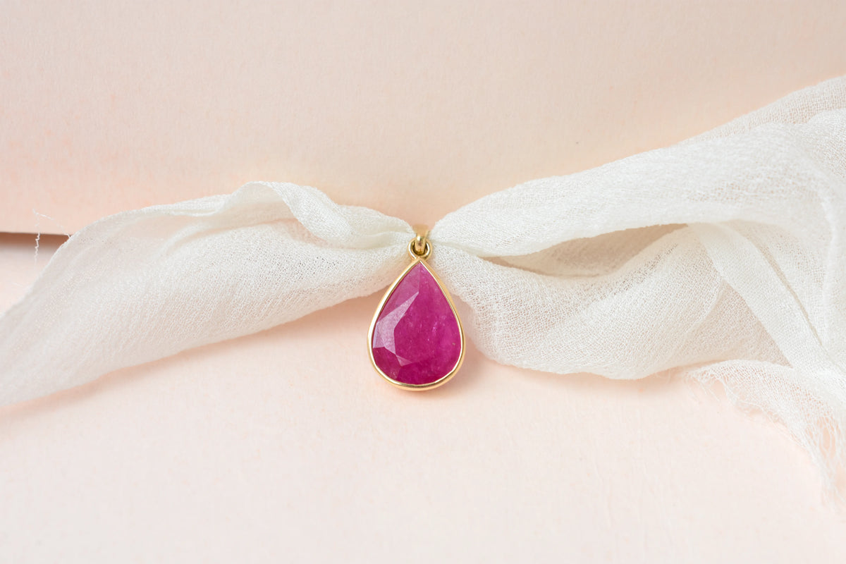 18K gold pendant with bezel-set rose-cut pear ruby