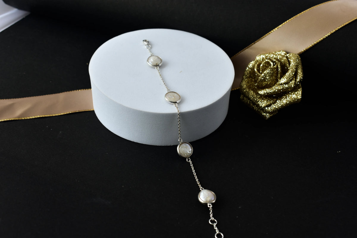 Coin pearl station bracelet with bezel-set pearls on a 925 silver chain