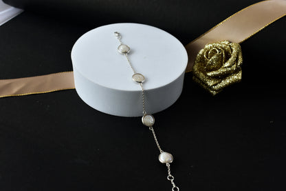Coin pearl station bracelet with bezel-set pearls on a 925 silver chain