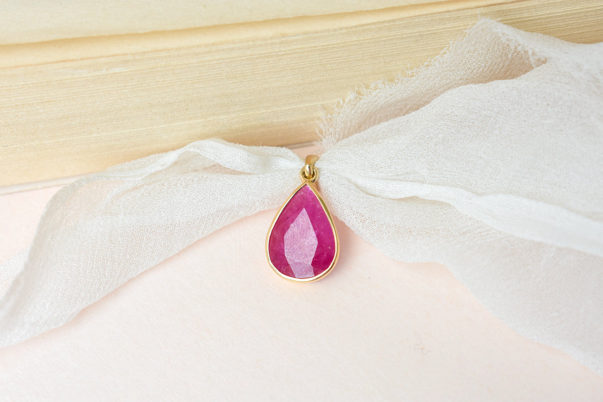 18K gold pendant with bezel-set rose-cut pear ruby