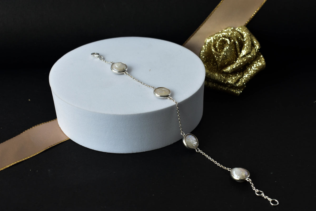 Coin pearl station bracelet with bezel-set pearls on a 925 silver chain