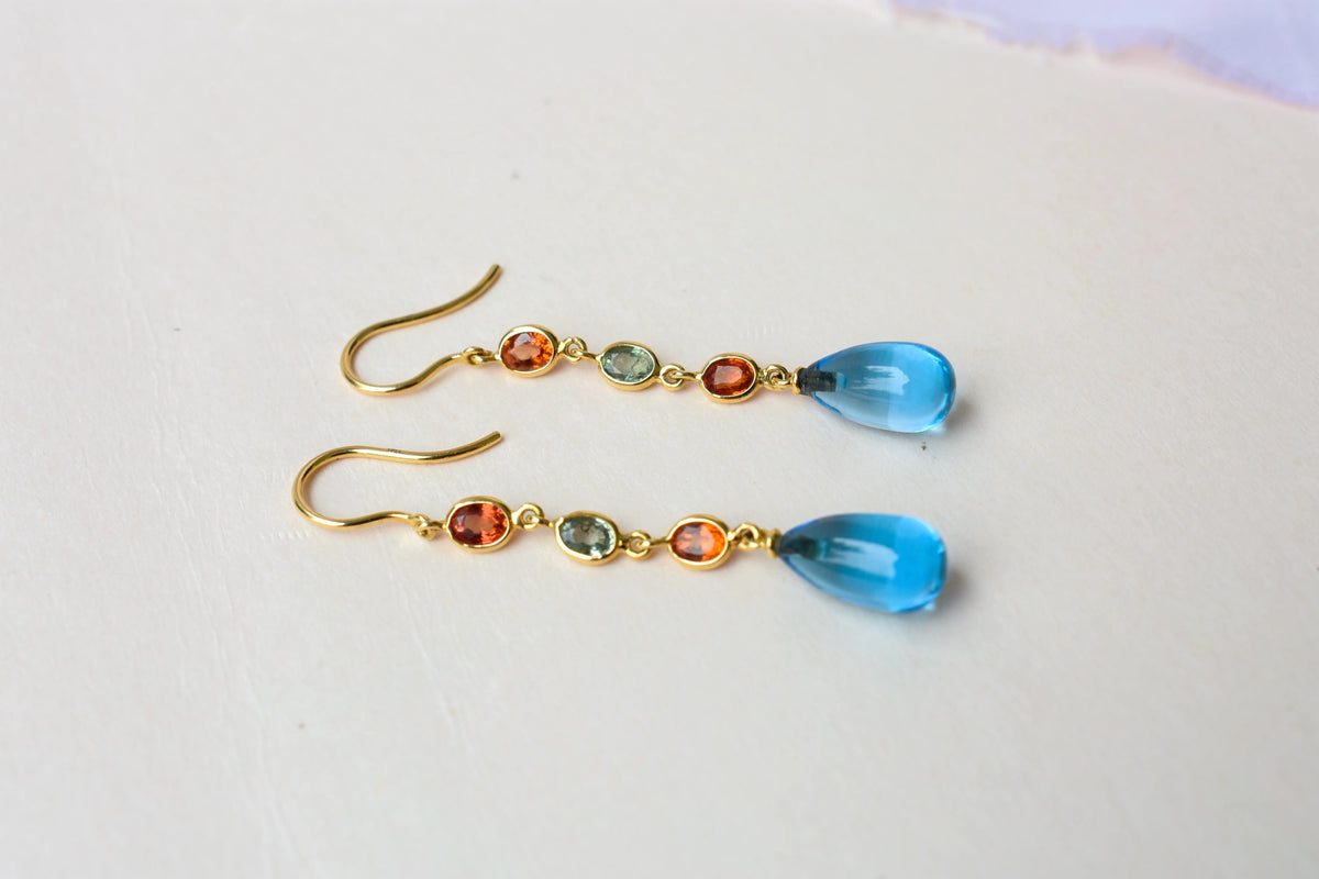 18K gold chain drop earrings with sapphire and blue topaz briolette