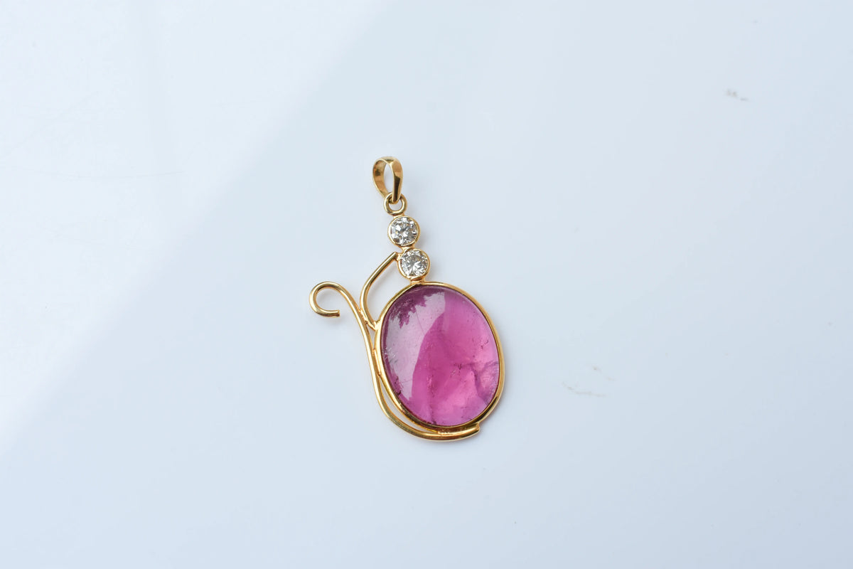 18K gold pendant with cabochon pink tourmaline and diamond accents