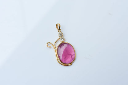 18K gold pendant with cabochon pink tourmaline and diamond accents