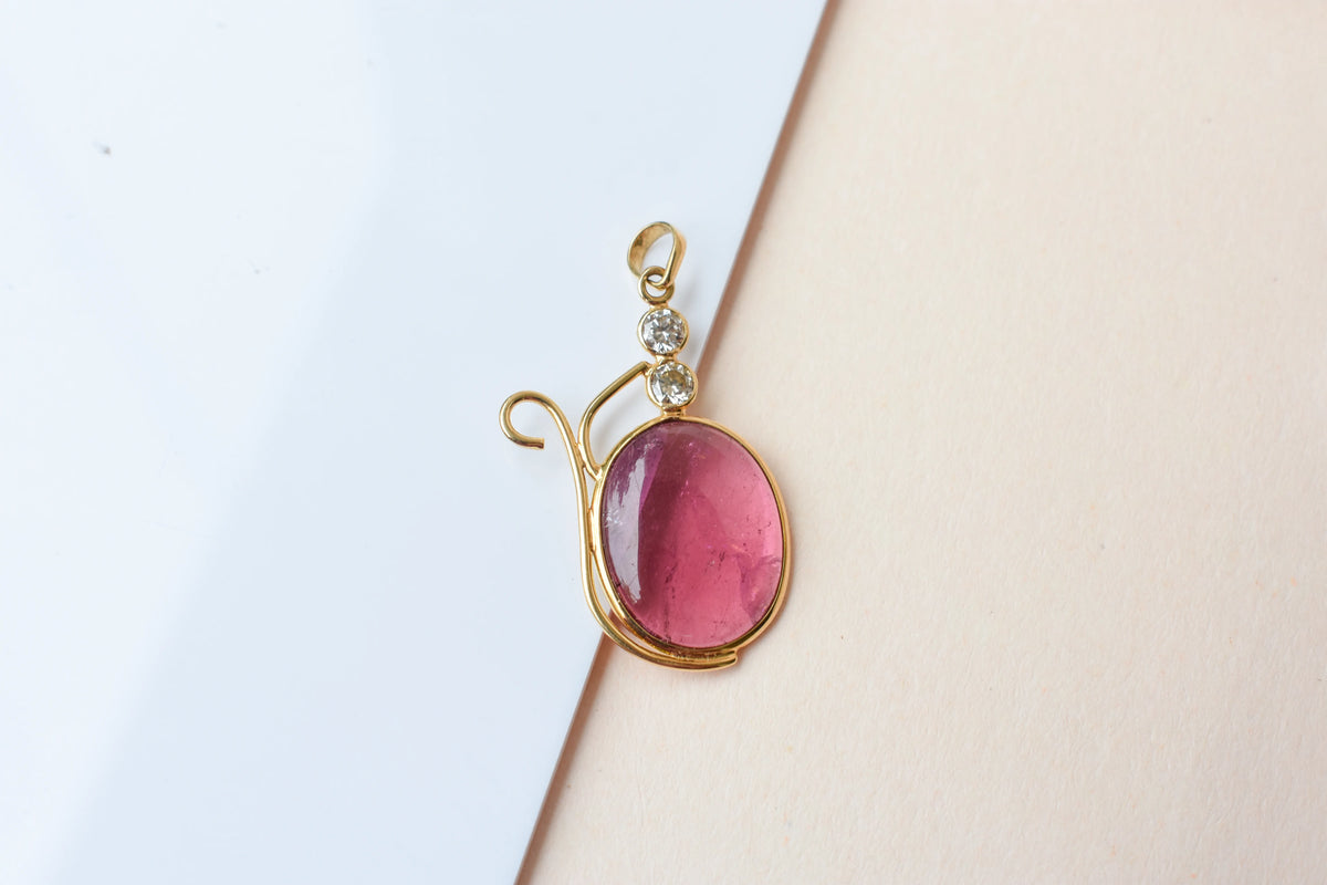 18K gold pendant with cabochon pink tourmaline and diamond accents