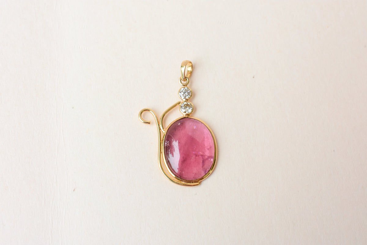 18K gold pendant with cabochon pink tourmaline and diamond accents
