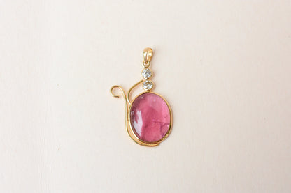 18K gold pendant with cabochon pink tourmaline and diamond accents