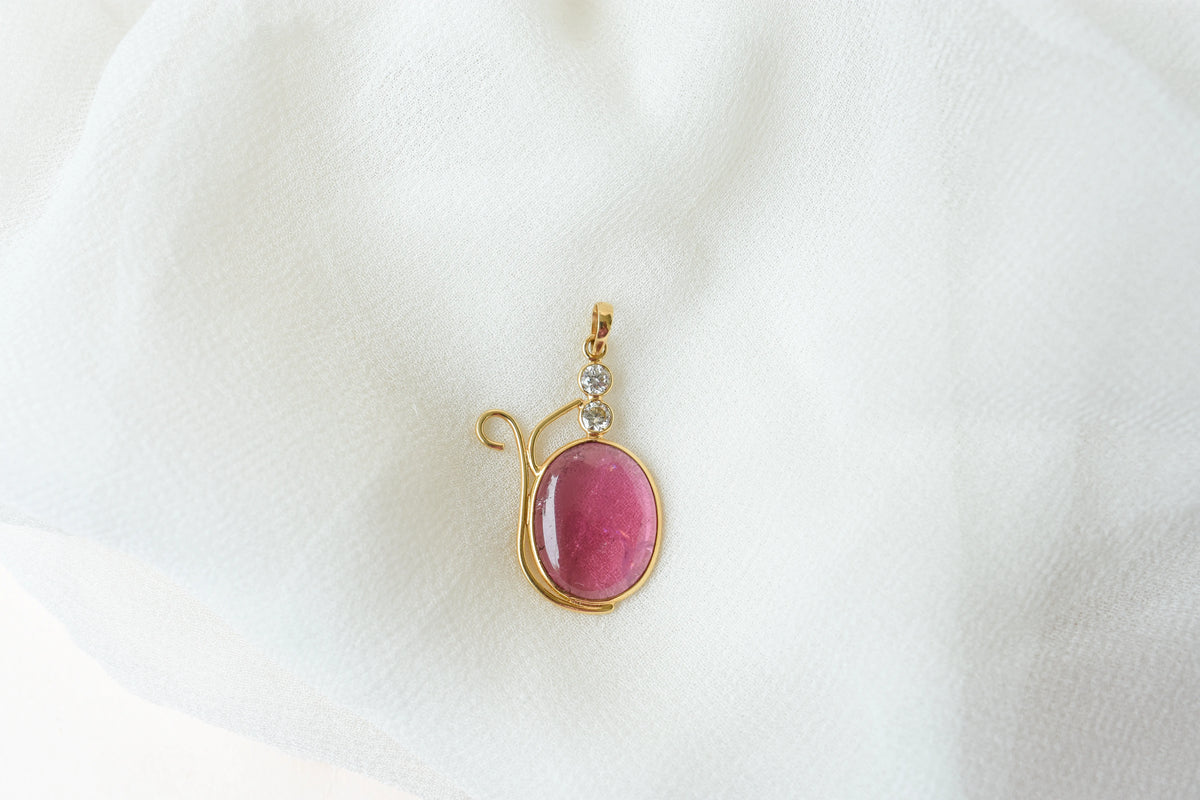 18K gold pendant with cabochon pink tourmaline and diamond accents