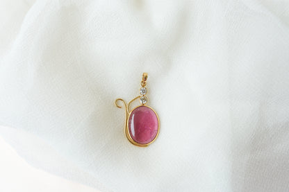 18K gold pendant with cabochon pink tourmaline and diamond accents