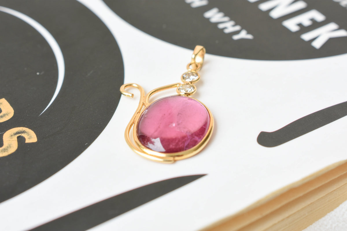 18K gold pendant with cabochon pink tourmaline and diamond accents