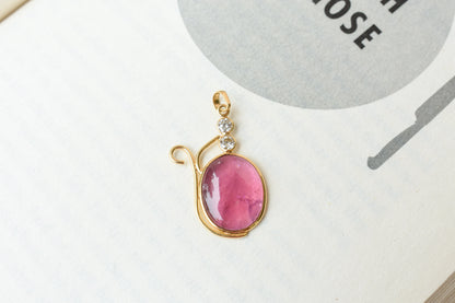 18K gold pendant with cabochon pink tourmaline and diamond accents