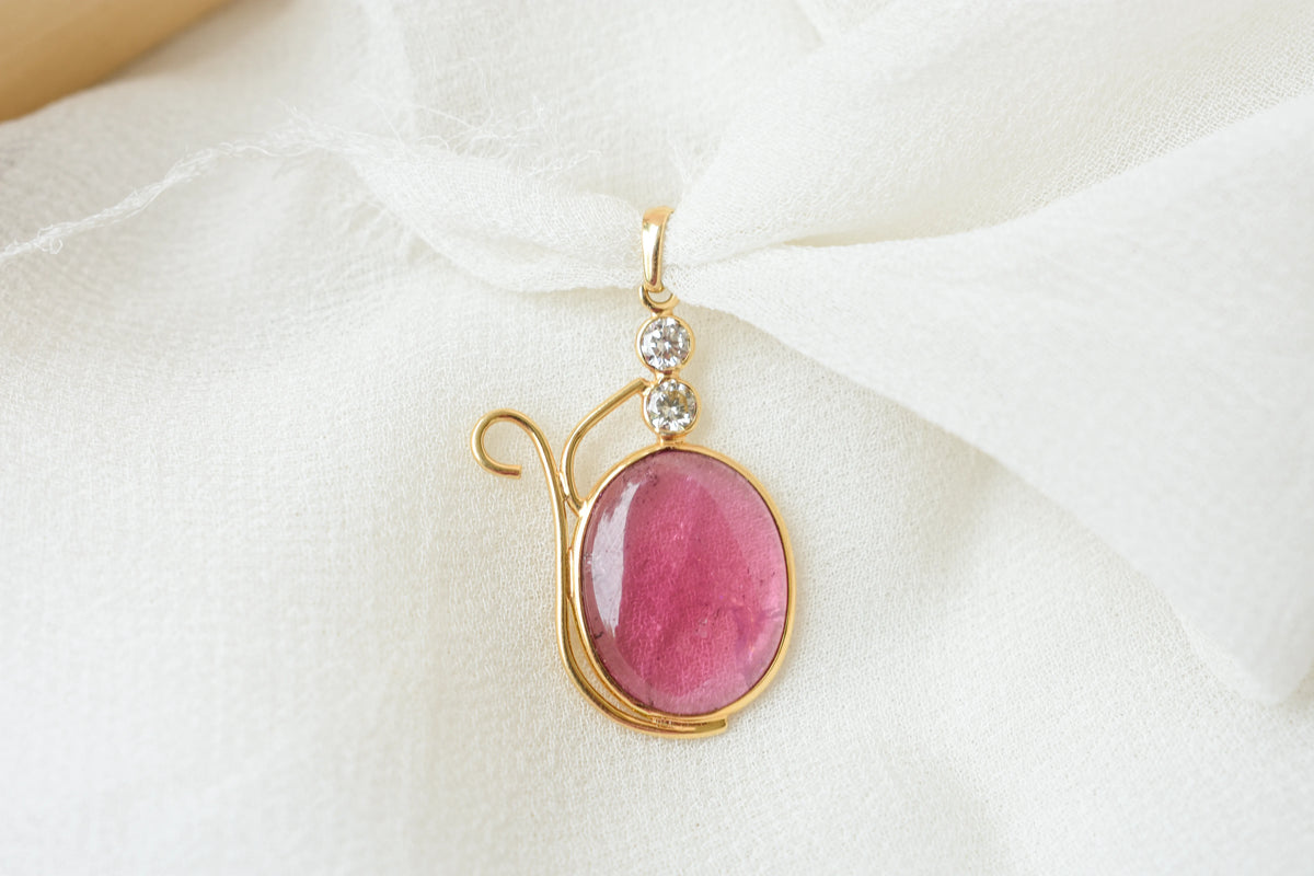 18K gold pendant with cabochon pink tourmaline and diamond accents