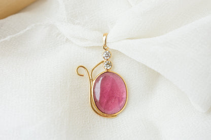 18K gold pendant with cabochon pink tourmaline and diamond accents
