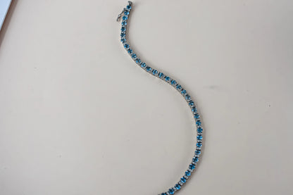 Swiss Blue Topaz tennis bracelet in 925 silver with cubic zirconia