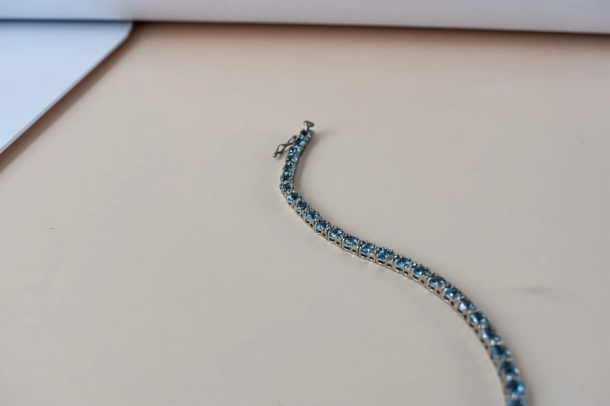 Swiss Blue Topaz tennis bracelet in 925 silver with cubic zirconia