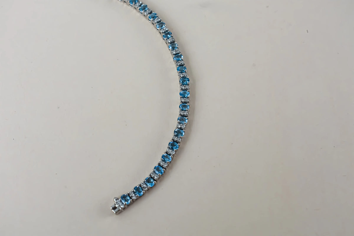 Swiss Blue Topaz tennis bracelet in 925 silver with cubic zirconia
