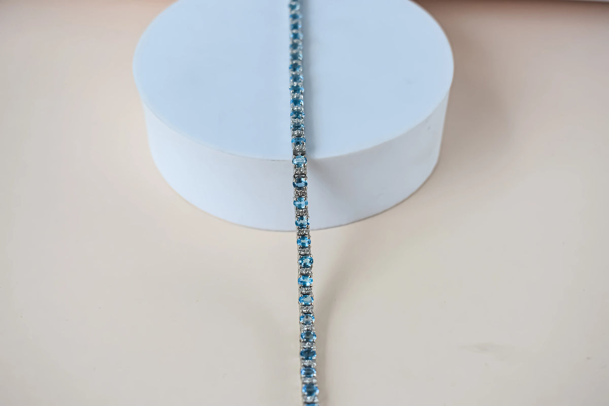 Swiss Blue Topaz tennis bracelet in 925 silver with cubic zirconia