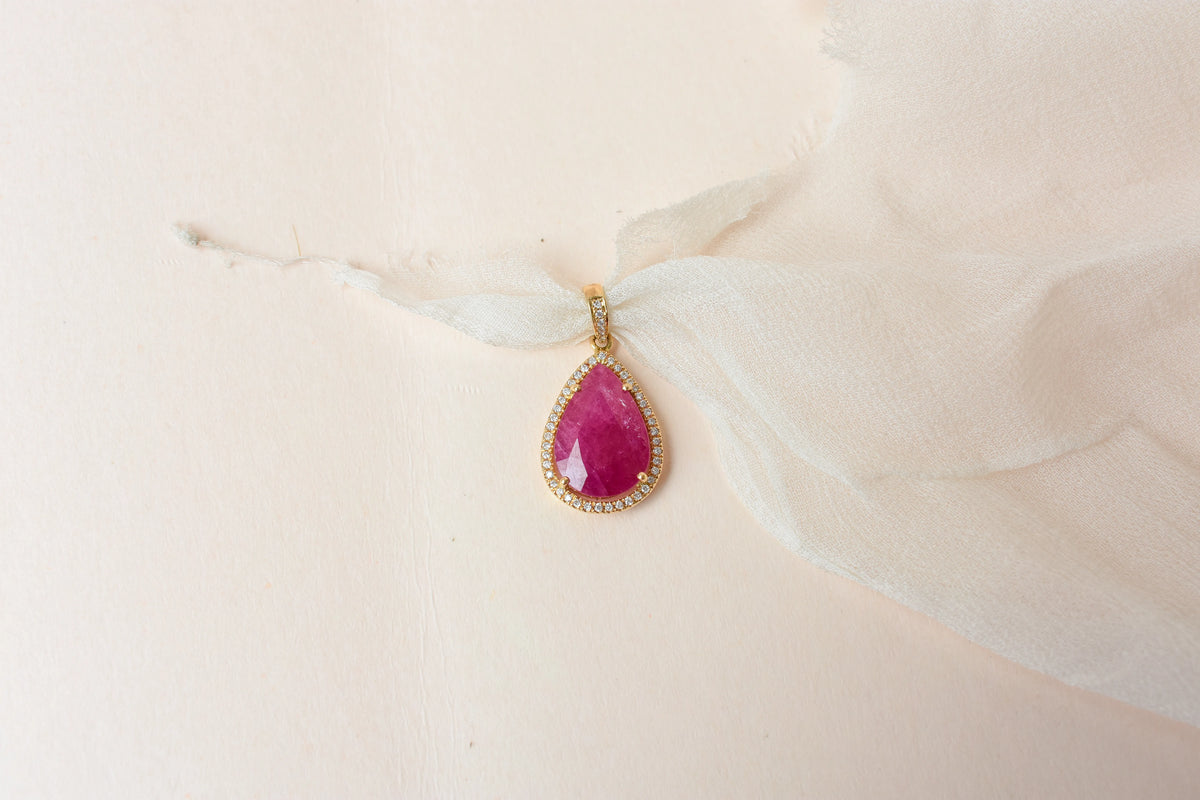 18K gold pendant with large rose-cut pear ruby and diamond halo