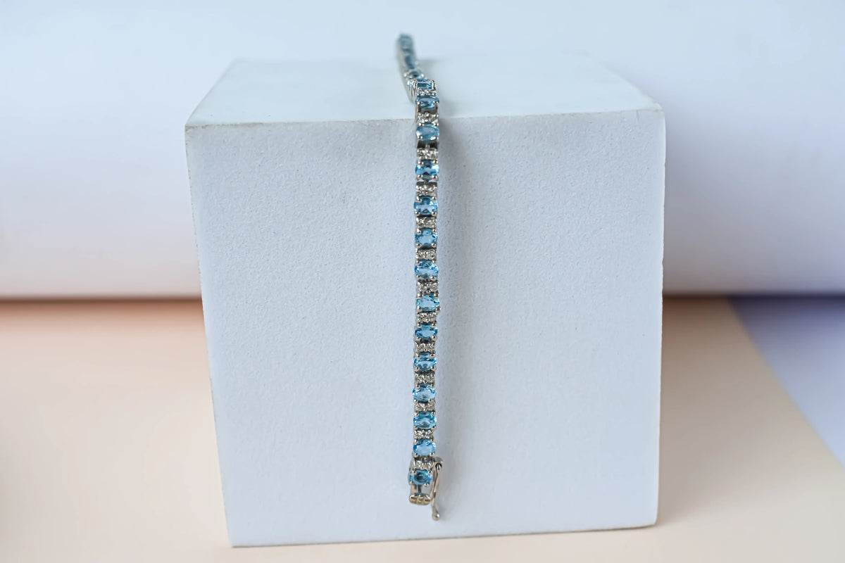 Swiss Blue Topaz tennis bracelet in 925 silver with cubic zirconia