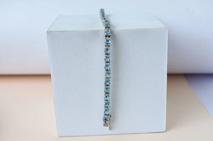 Swiss Blue Topaz tennis bracelet in 925 silver with cubic zirconia