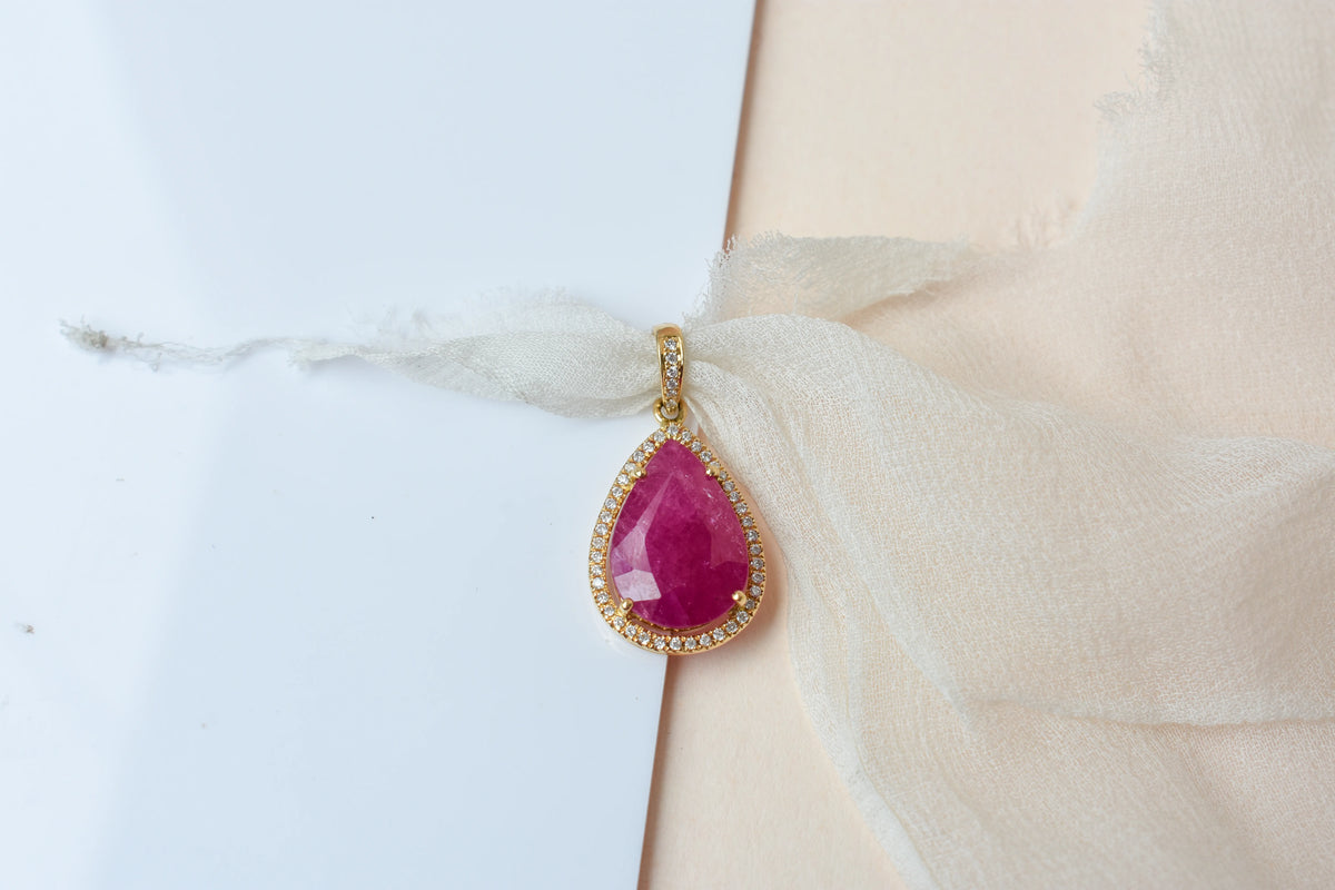 18K gold pendant with large rose-cut pear ruby and diamond halo