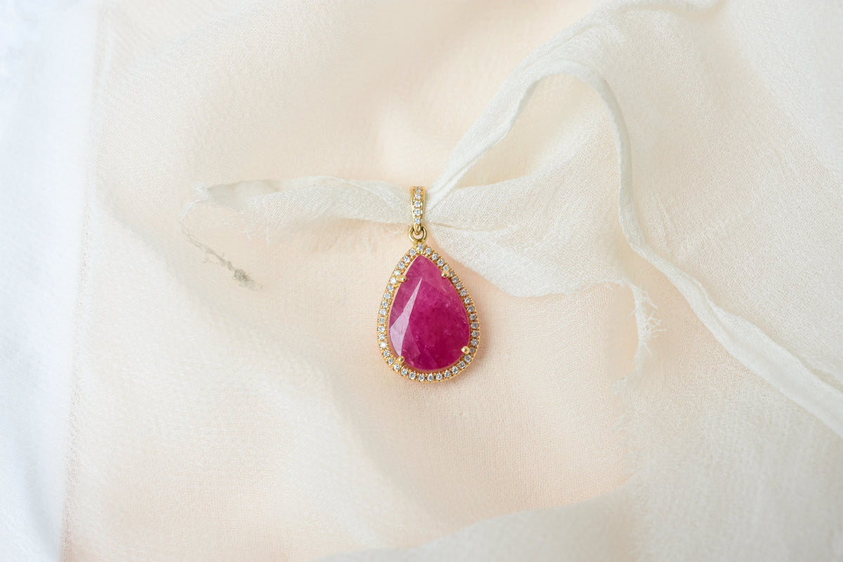 18K gold pendant with large rose-cut pear ruby and diamond halo
