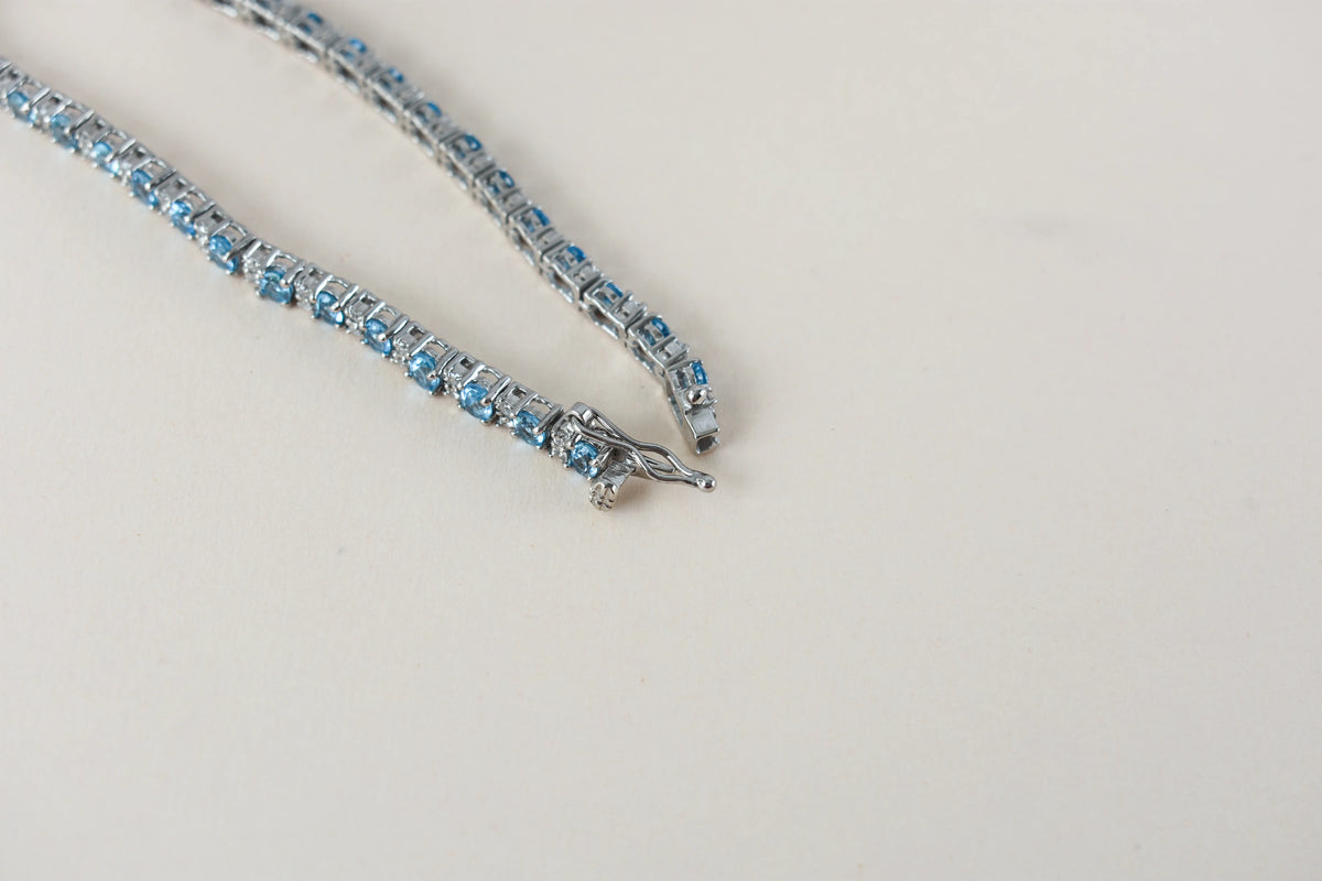 Swiss Blue Topaz tennis bracelet in 925 silver with cubic zirconia