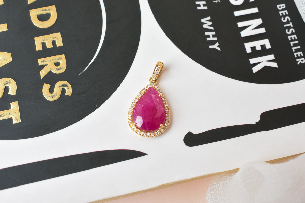 18K gold pendant with large rose-cut pear ruby and diamond halo