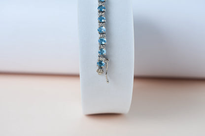 Swiss Blue Topaz tennis bracelet in 925 silver with cubic zirconia