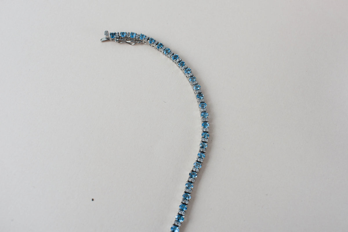 Swiss Blue Topaz tennis bracelet in 925 silver with cubic zirconia