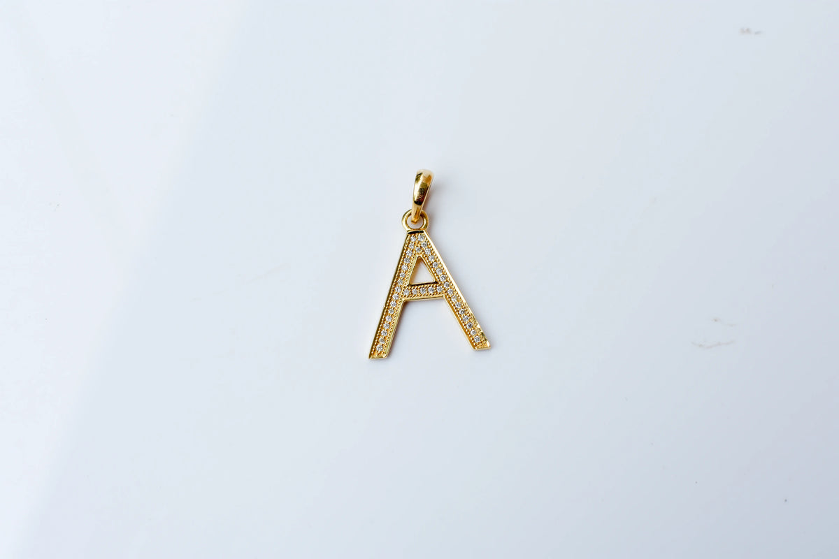 18K gold pendant with diamond pavé letter A