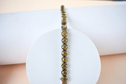 Round-cut beer quartz tennis bracelet in 925 silver with fold-over clasp