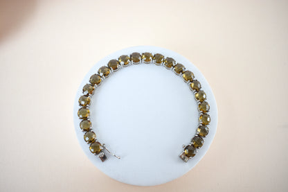 Round-cut beer quartz tennis bracelet in 925 silver with fold-over clasp