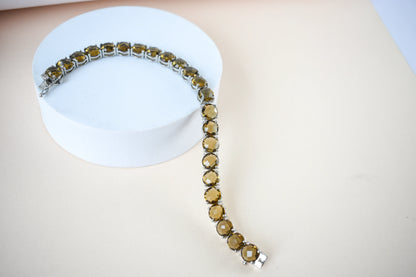 Round-cut beer quartz tennis bracelet in 925 silver with fold-over clasp