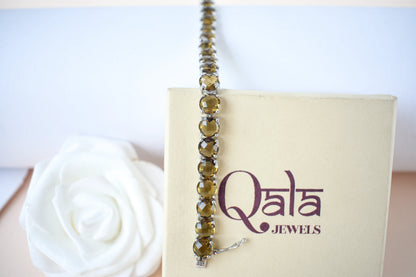 Round-cut beer quartz tennis bracelet in 925 silver with fold-over clasp