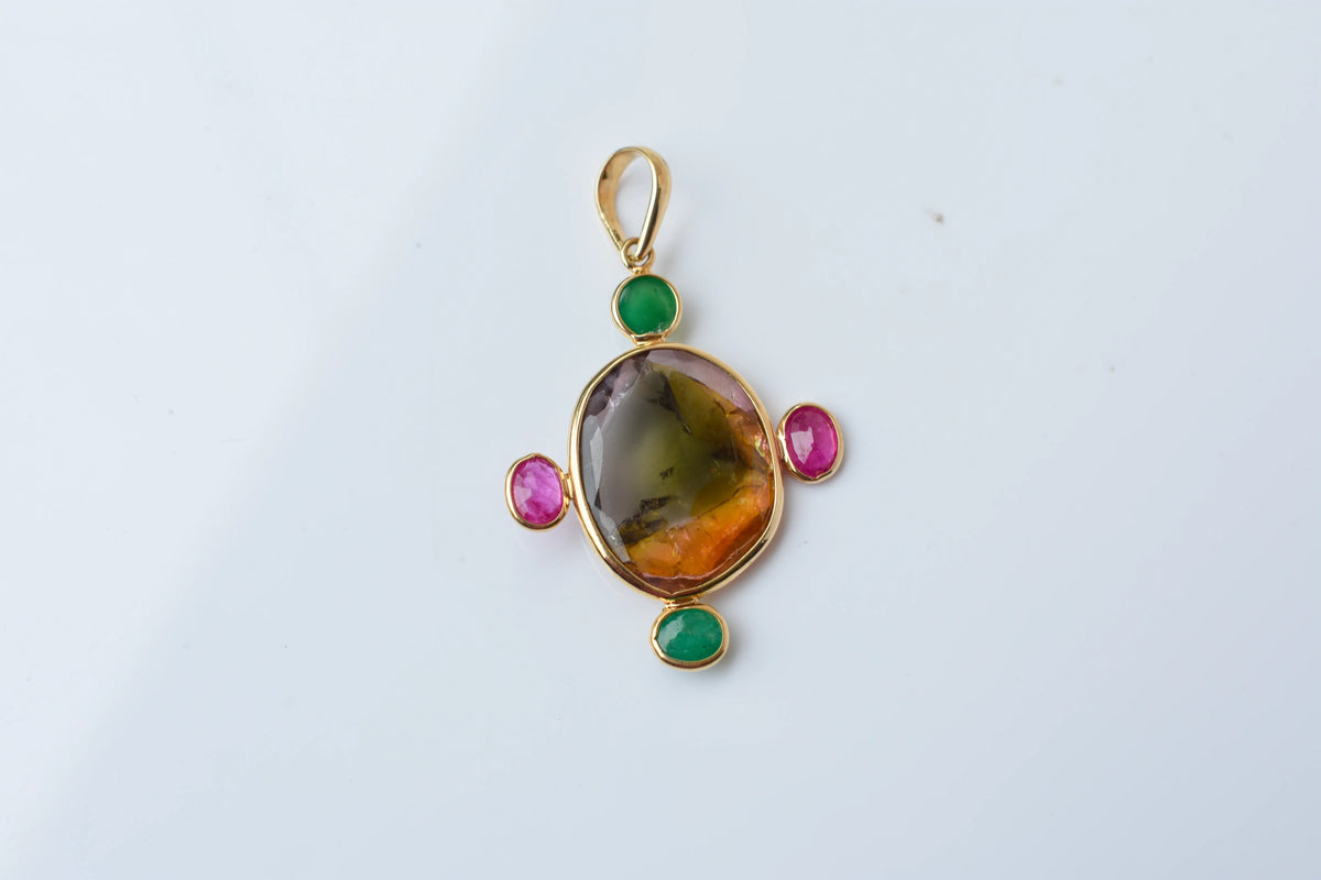 18K gold cross pendant with tourmaline, ruby, and emerald