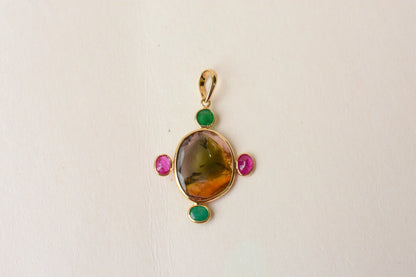 18K gold cross pendant with tourmaline, ruby, and emerald