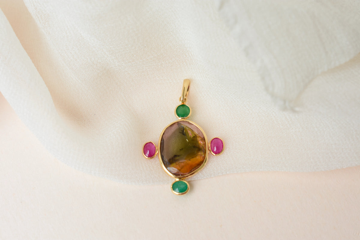 18K gold cross pendant with tourmaline, ruby, and emerald