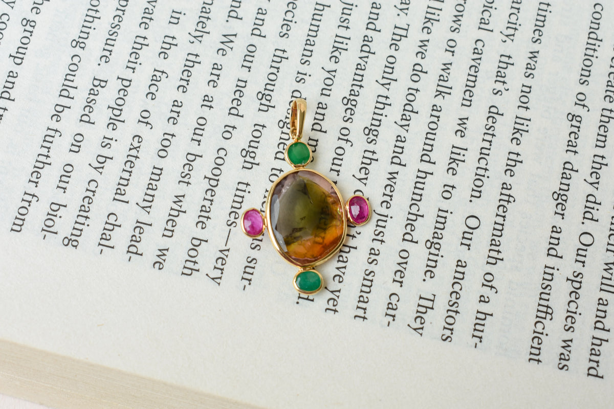 18K gold cross pendant with tourmaline, ruby, and emerald