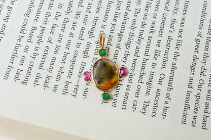 18K gold cross pendant with tourmaline, ruby, and emerald
