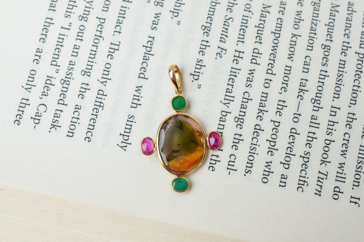 18K gold cross pendant with tourmaline, ruby, and emerald