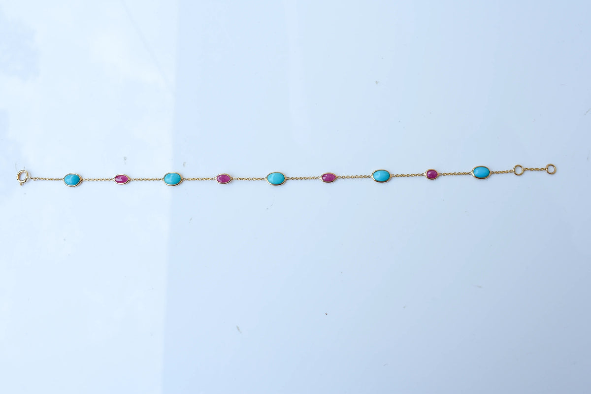 18K gold bracelet with turquoise and ruby stations