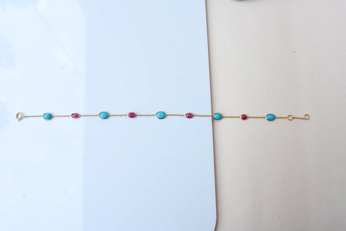 18K gold bracelet with turquoise and ruby stations
