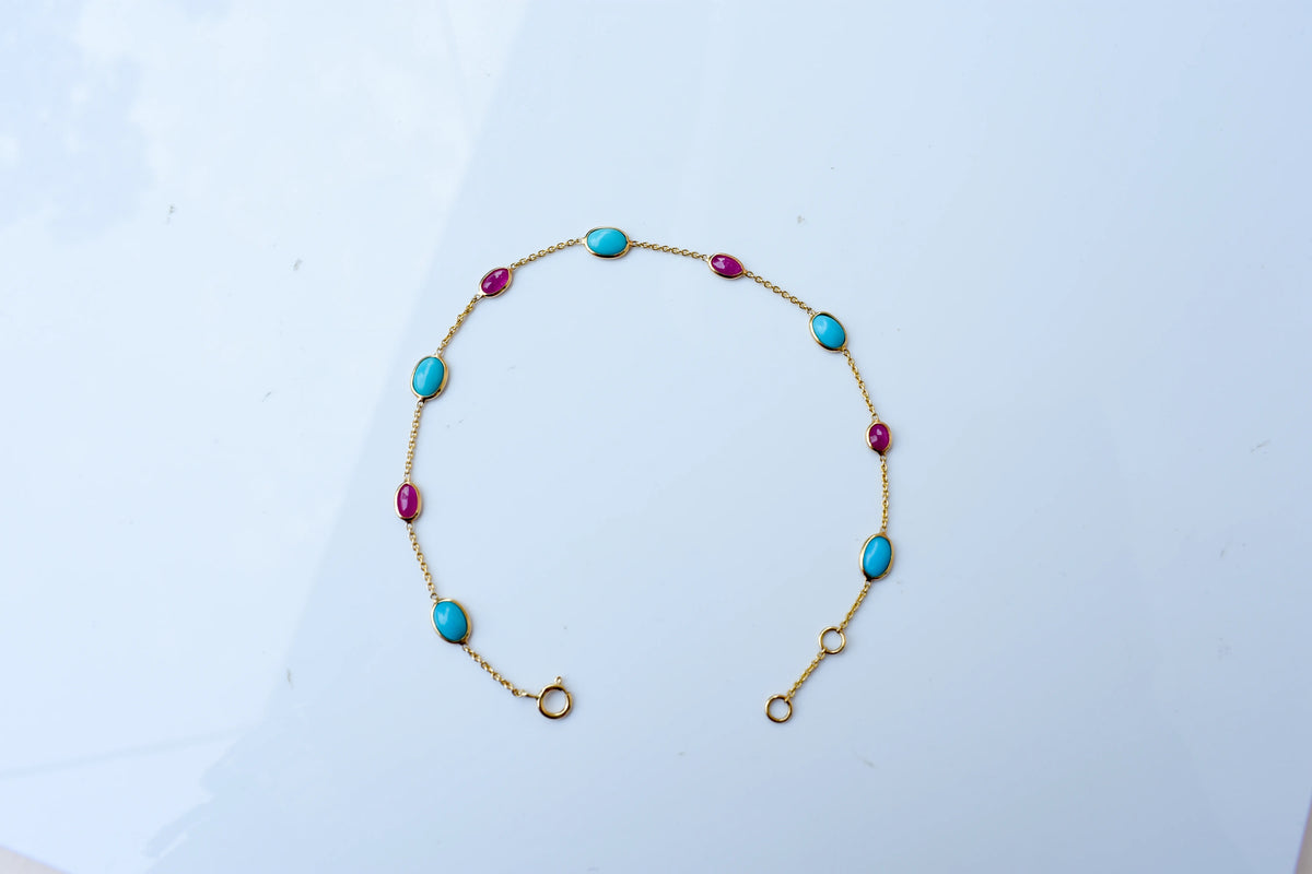18K gold bracelet with turquoise and ruby stations