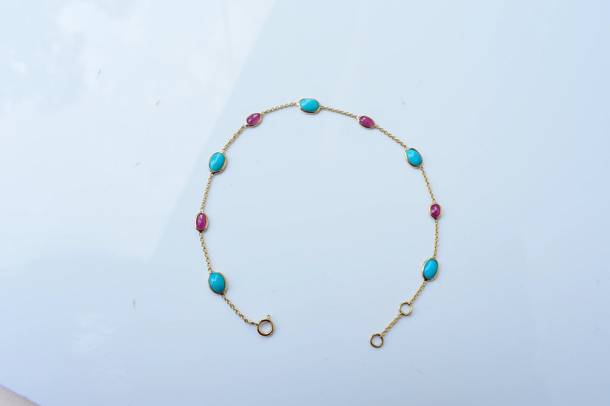 18K gold bracelet with turquoise and ruby stations