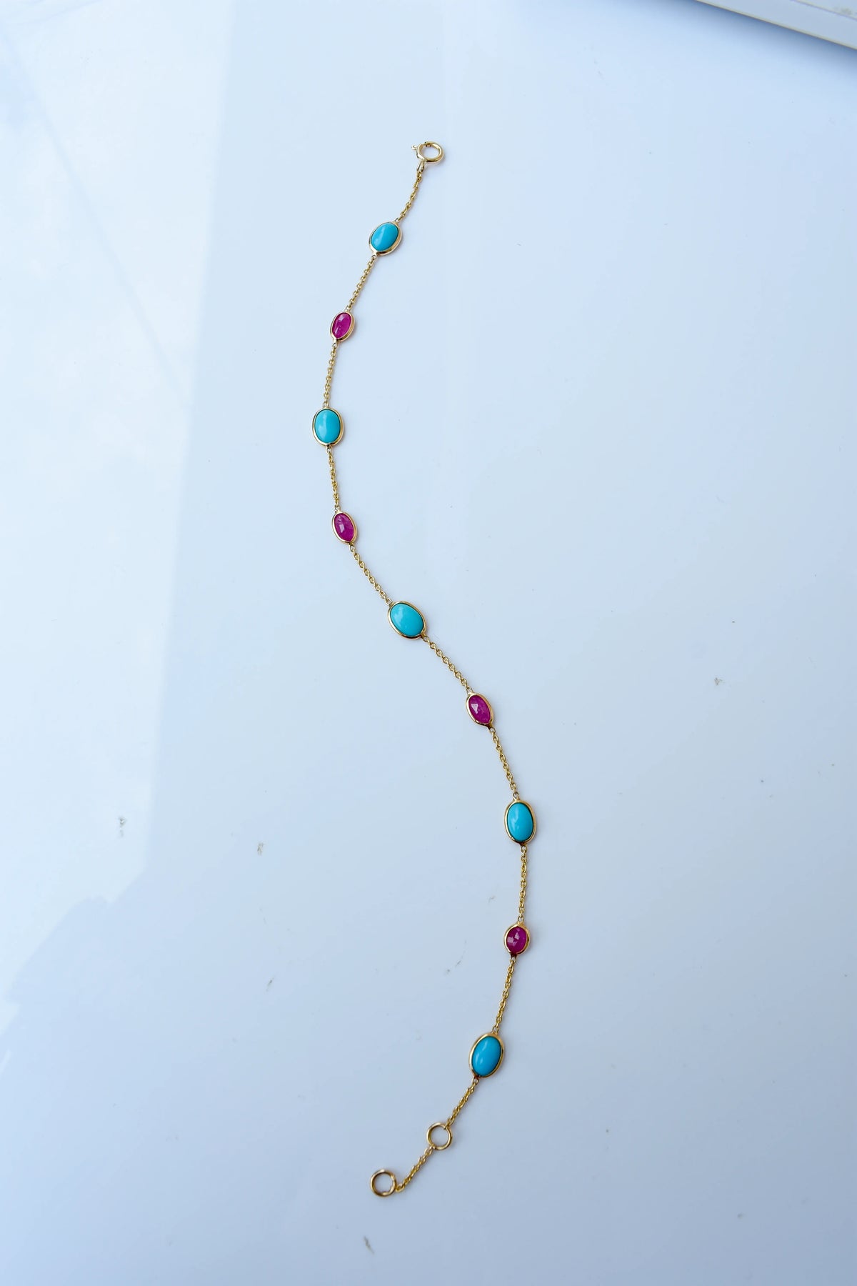 18K gold bracelet with turquoise and ruby stations