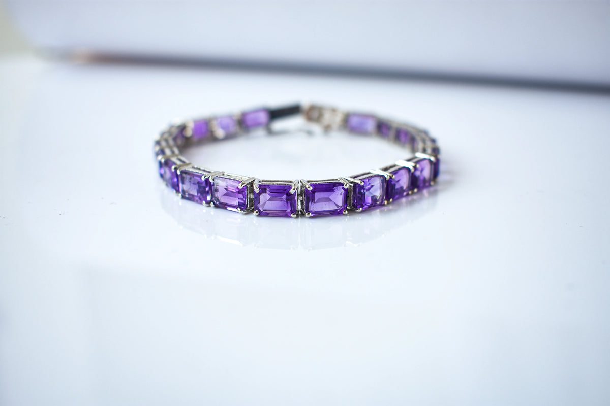Deep purple emerald-cut gemstone tennis bracelet in 925 silver