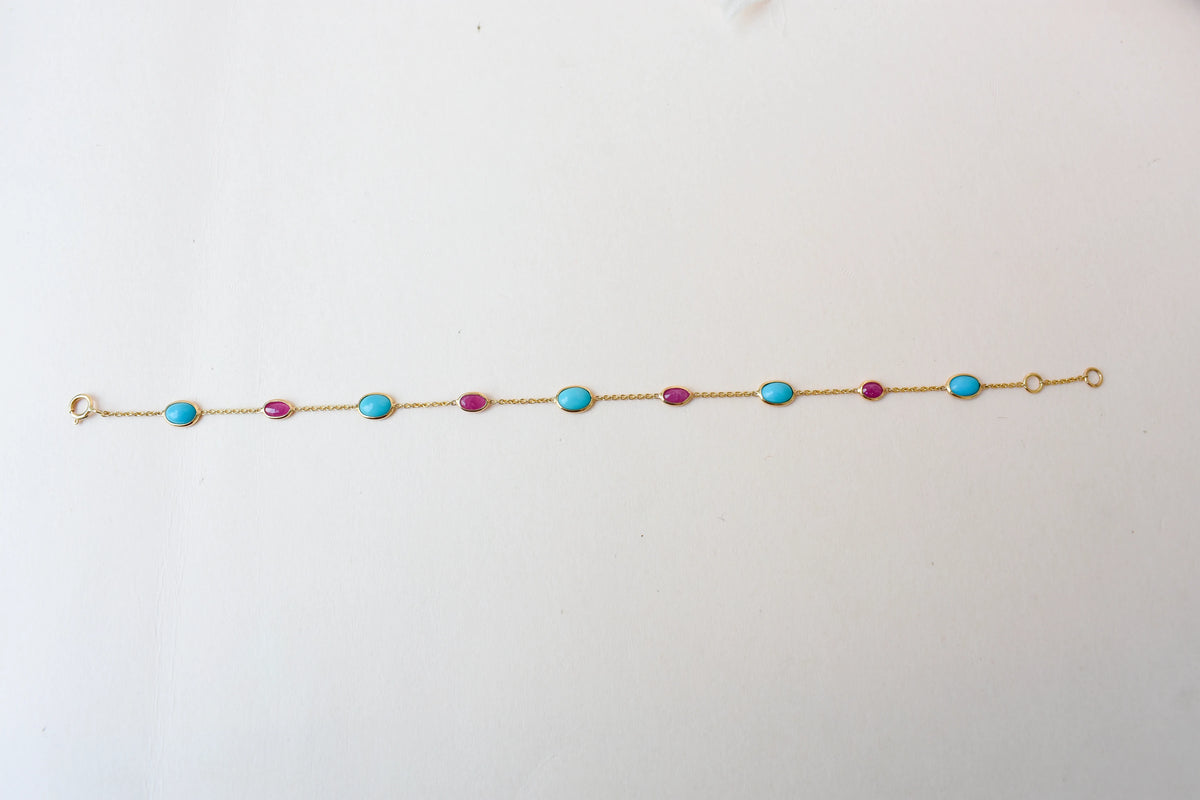 18K gold bracelet with turquoise and ruby stations