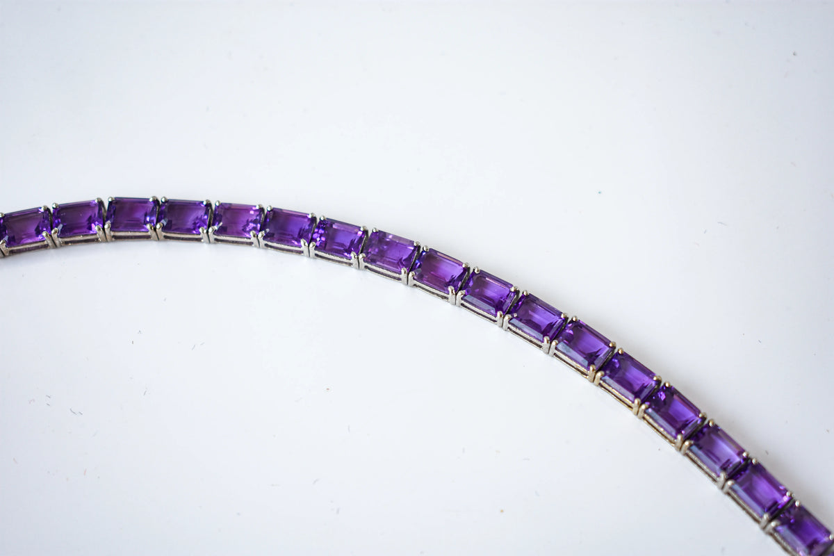 Deep purple emerald-cut gemstone tennis bracelet in 925 silver